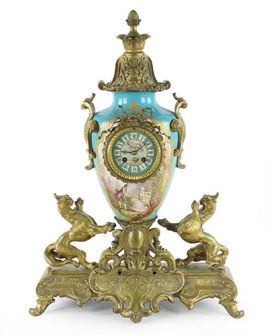 A Sevres Style Mantle Clock.: A Sevres Style Mantle Clock. Gilt and painted porcelain urn form clock with ormolu mountings throughout. Porcelain is signed "A. Daret" along the side. Face of clock reads "Union Square New York". Mov