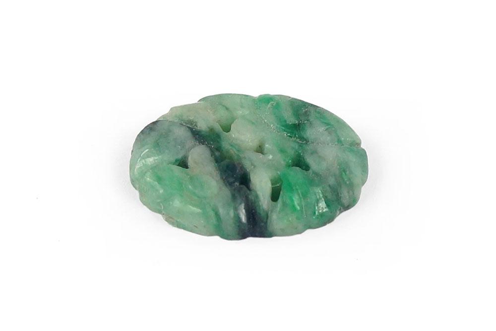 A Jade Carving.: A Jade Carving. Carved oval jade plaque is approximately 19.5mm x 15mm