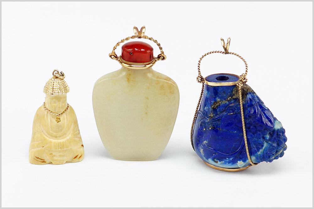 A Mutton Fat Jade Snuff Bottle Pendant.: A Mutton Fat Jade Snuff Bottle Pendant. Jade snuff bottle with an agate stopper and 14 karat yellow gold pendant mounting. Together with a carved sodalite snuff bottle (lacking lid) which is mounted i