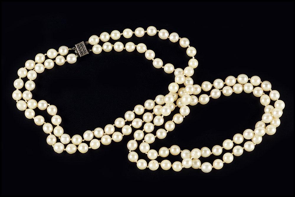 A Cultured Baroque Pearl Necklace.: A Cultured Baroque Pearl Necklace. Double strand pearl necklace with a sterling silver clasp. Pearls are approximately 7.5mm - 8mm Shorter strand: 24.5" Wt: 90.5 grams