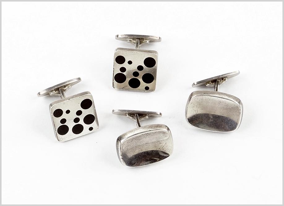 A Pair of Georg Jensen Enamel and Sterling Silver: A Pair of Georg Jensen Enamel and Sterling Silver Cufflinks. Square cufflinks with black dot enamel decoration. Stamped with Jensen markings and numbered 93b. Together with a pair of Bent Knudsen ster