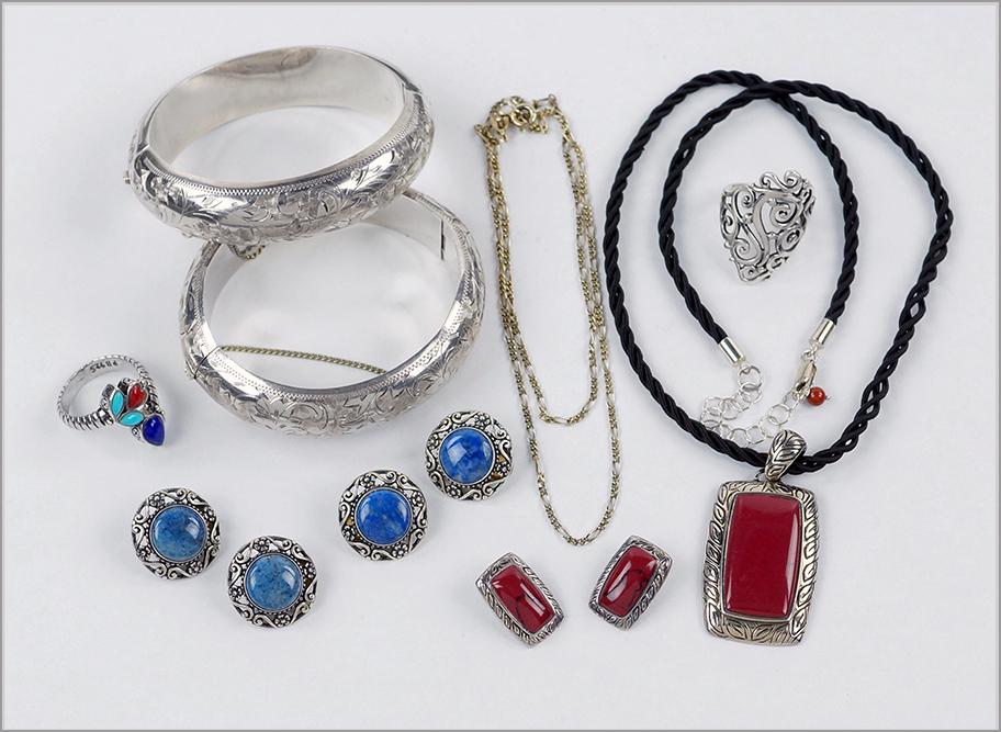 A Pair of Engraved Sterling Silver Bangle Bracelets. (1 of 1)