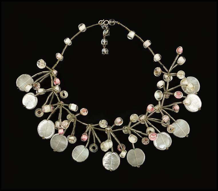 A Langani Necklace.: A Langani Necklace. Grey/silver bugle bead necklace with drops of grey, pink and clear glass. Unsigned, with black seed bead Length: 17"