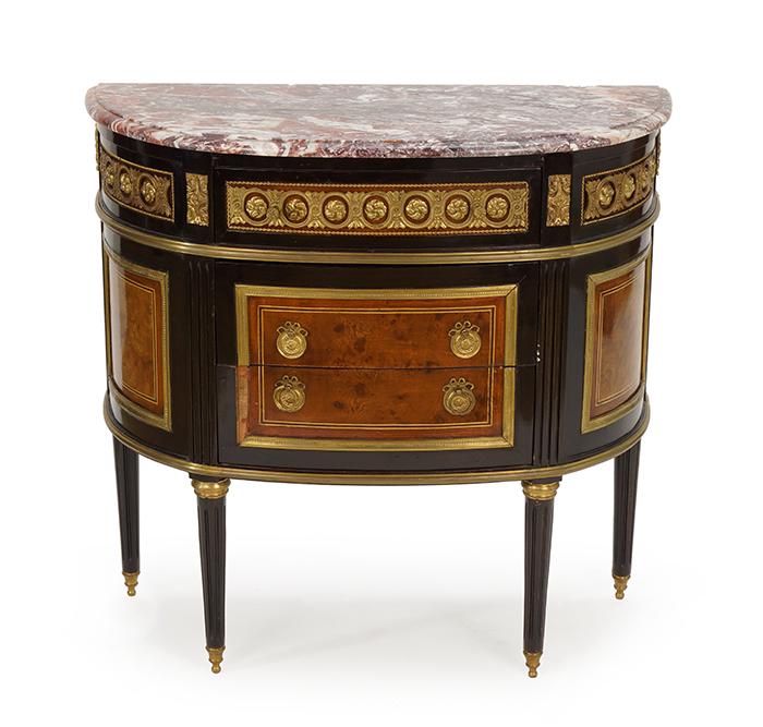 A French Marble Top Demilune Cabinet.: A French Marble Top Demilune Cabinet. Ebonized three-drawer cabinet bearing burl veneer and ormolu mountings throughout 32" x 34" x 14.5"