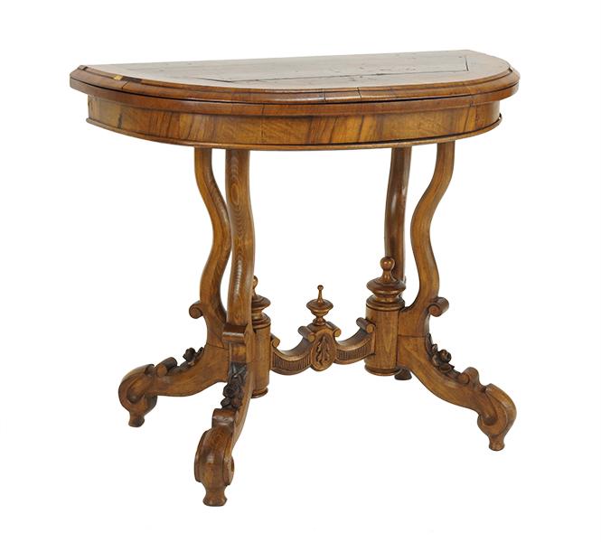 A Carved Walnut Flip-Top Games Table. (1 of 2)