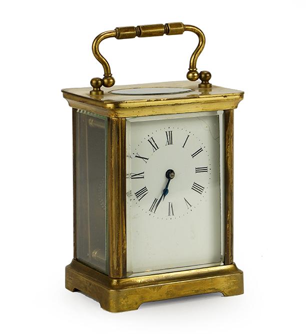 French Brass Carriage Clock.: French Brass Carriage Clock. Featuring a beveled glass, porcelain face carriage clock, marked Made in France. Susanin's will not comment on the working condition of any watch or clock movement 5.5" x 