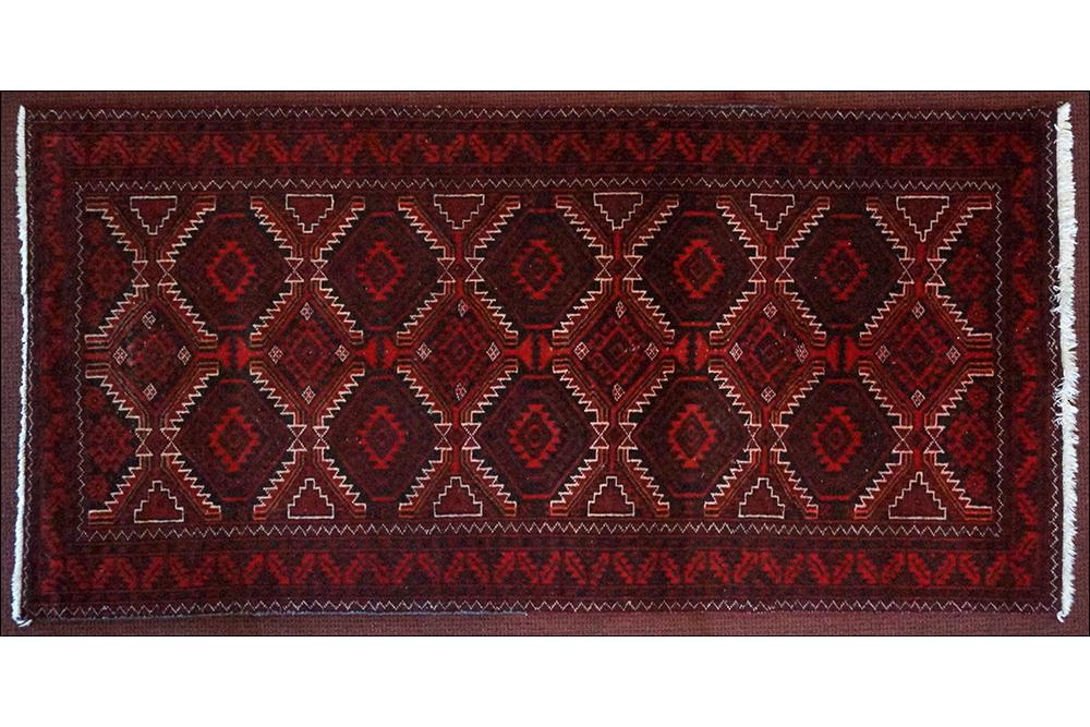 A Bokhara Style Rug. (1 of 5)