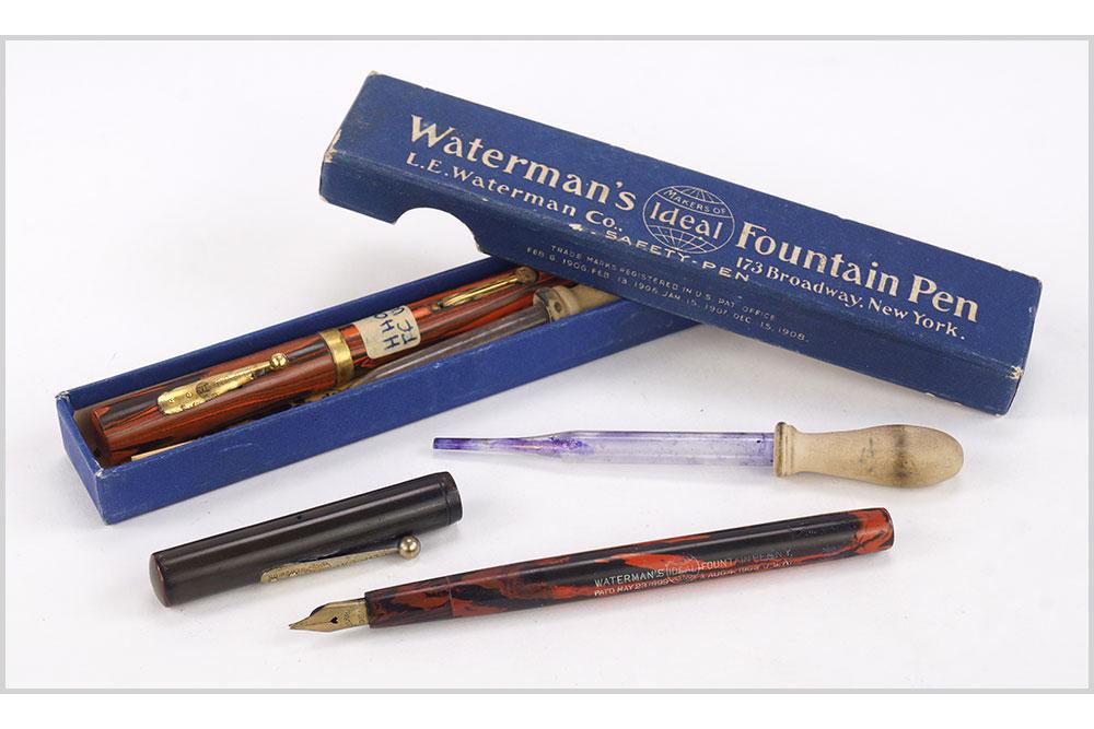 Waterman Red Hard Plastic Fountain Pens.: Waterman Red Hard Plastic Fountain Pens. Consisting of two Waterman red hard plastic fountain pens in Waterman boxes Length: 5 1/8"