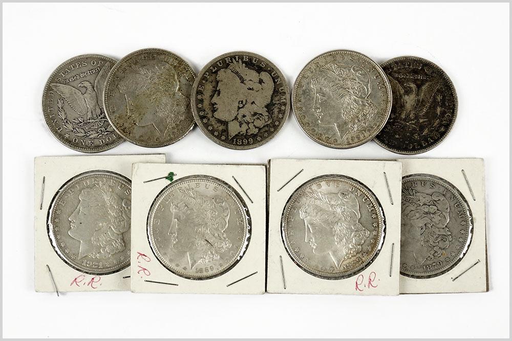 Nine Morgan Silver Dollars. (1 of 1)