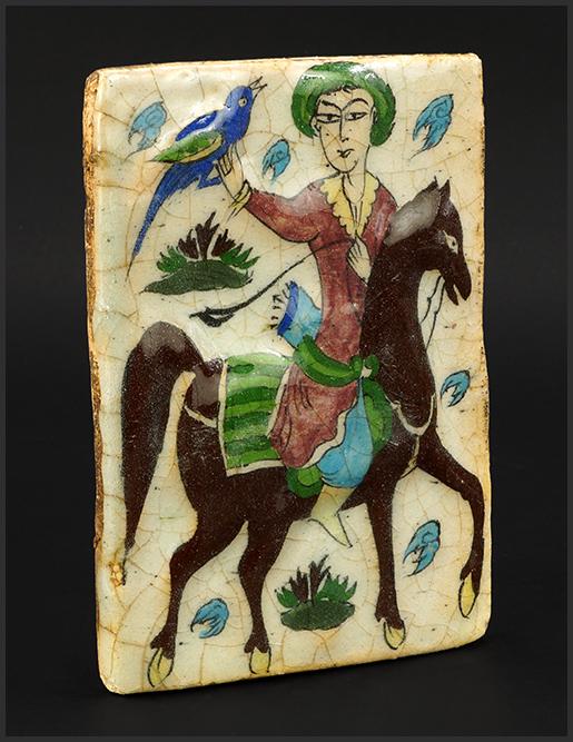 A Persian Glazed Ceramic Tile of a Falconer. (1 of 5)