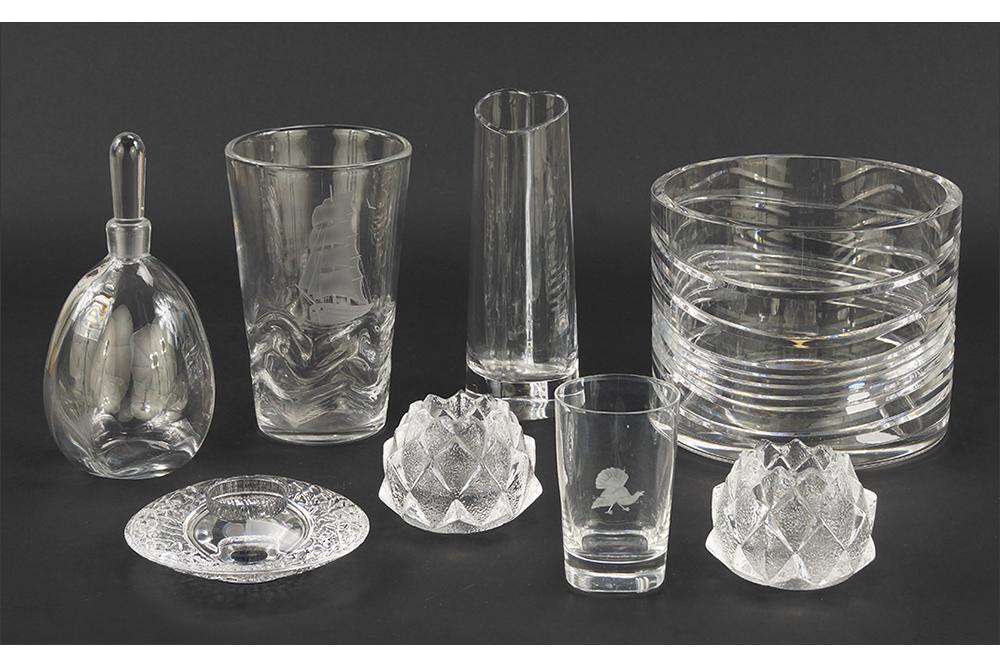 A Collection of Orrefors Glass.: A Collection of Orrefors Glass. Comprising a decanter, a pair of artichoke votives, a round votive, a glass, two vases and a round flower bowl (6.25" x 7.75")