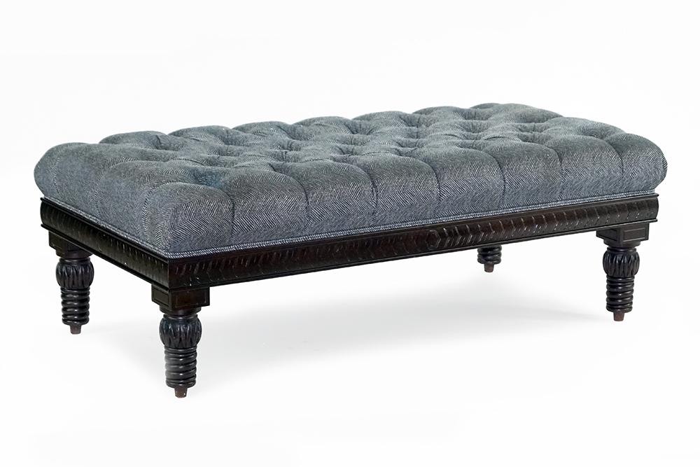 An Upholstered Tufted Ottoman. (1 of 2)
