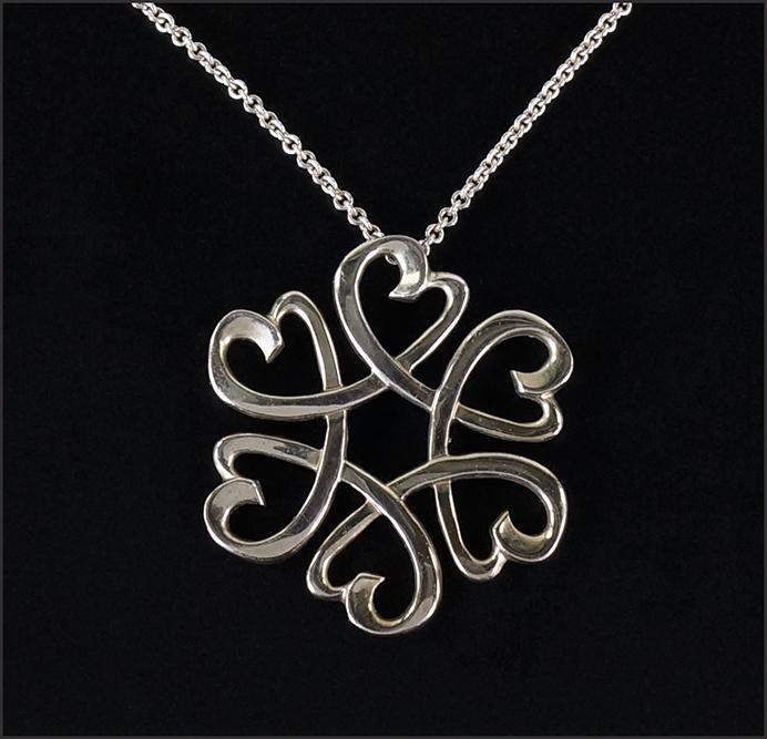 A Paloma PIcasso for Tiffany & Company Necklace.: A Paloma PIcasso for Tiffany & Company Necklace. Sterling silver link necklace with an interlocking heart pendant (Diameter: 1 1/4") Length: 18" Wt: 8.3 grams