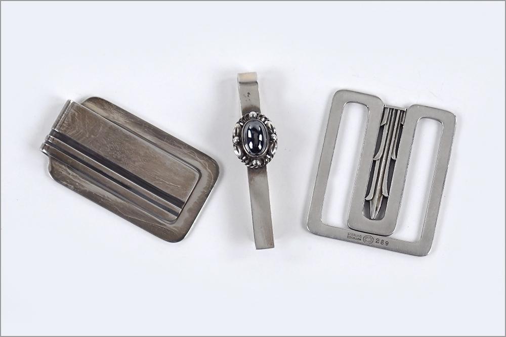Two Georg Jensen Sterling Silver Money Clips.: Two Georg Jensen Sterling Silver Money Clips. Both stamped with Jensen markings and 280 and 409. Together with a Georg Jensen sterling silver and hematite tiebar, 17 (length: 2.25") Larger money clip: