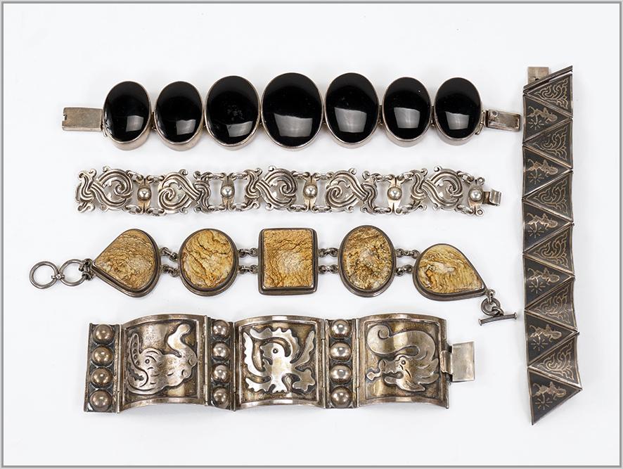 Two Mexican Sterling Silver Link Bracelets.: Two Mexican Sterling Silver Link Bracelets. Together with a graduated onyx and sterling silver bracelet, a Siamese enamel and sterling silver bracelet and a jasper and silver link bracelet