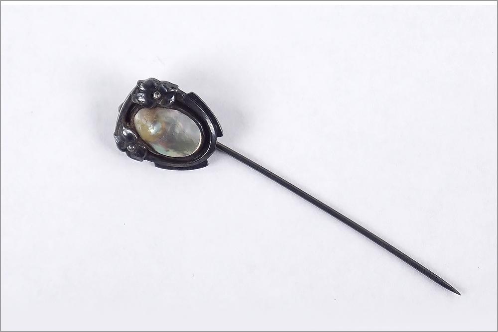 A Kalo Stick Pin.: A Kalo Stick Pin. Sterling silver stick pin mounted with a blister pearl. Signed on the reverse Length: 2.5"
