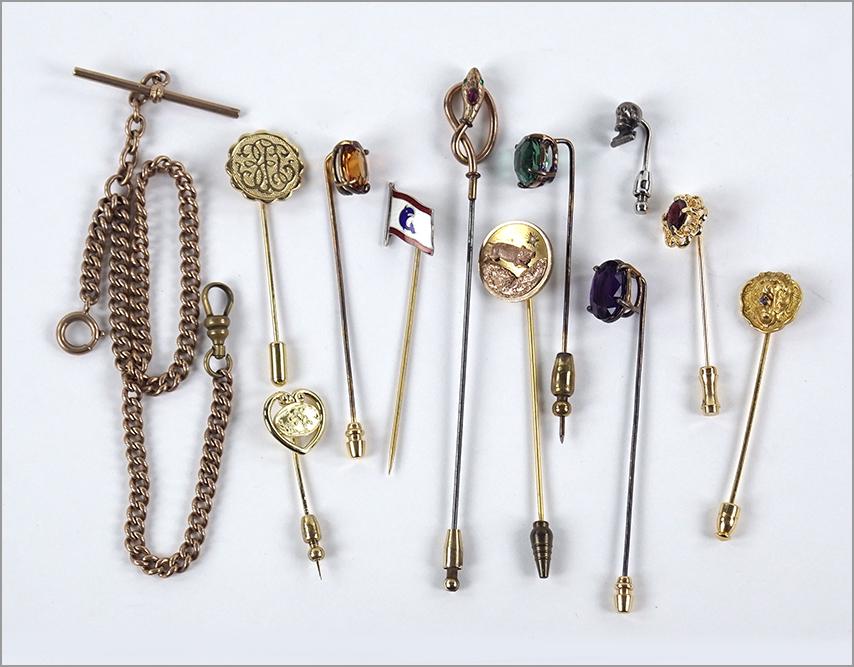 A Collection of Stick Pins.: A Collection of Stick Pins. Comprising two goldfilled stick pins and an assortment of metal stick pins. Together with a Victorian goldfilled watch chain