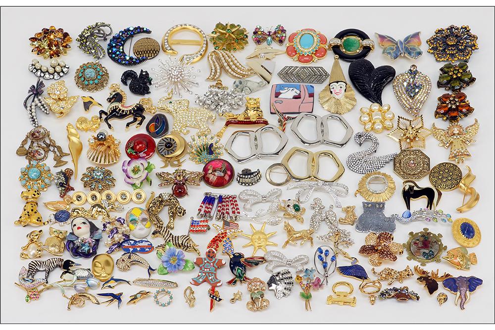 A Collection of Brooches.: A Collection of Brooches. Signed pieces by Bob Mackie, Graziano, Trifari, Florenza, Nolan Miller, Swarovski and others. Together with an assortment of unsigned brooches