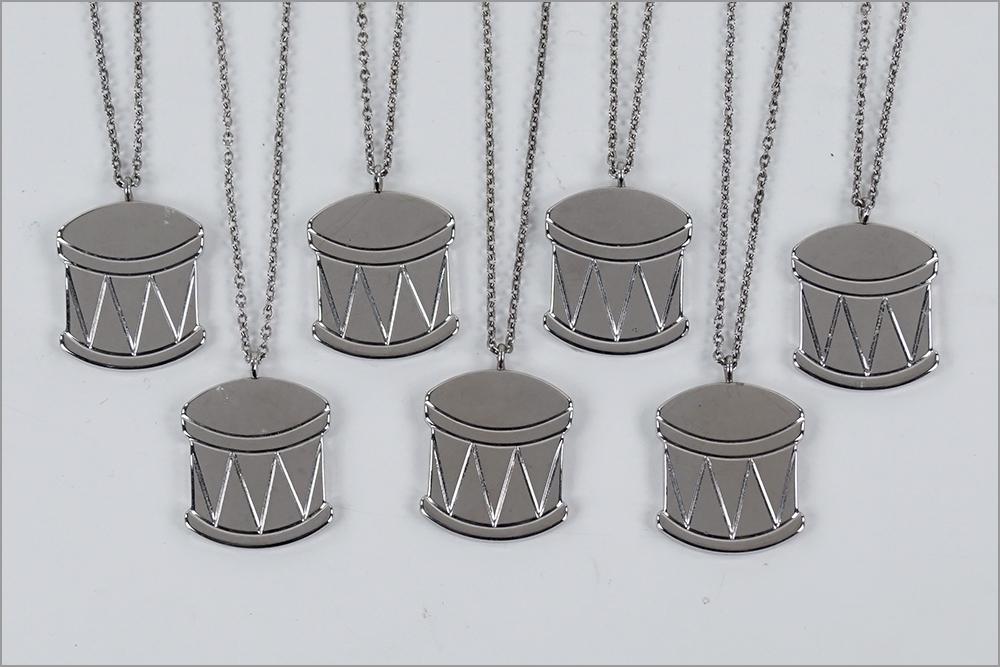 A Set of Seven Georg Jensen Christmas Ornaments.: A Set of Seven Georg Jensen Christmas Ornaments. Platinum plated snare drum form ornaments Drum: 1.25" x 1"