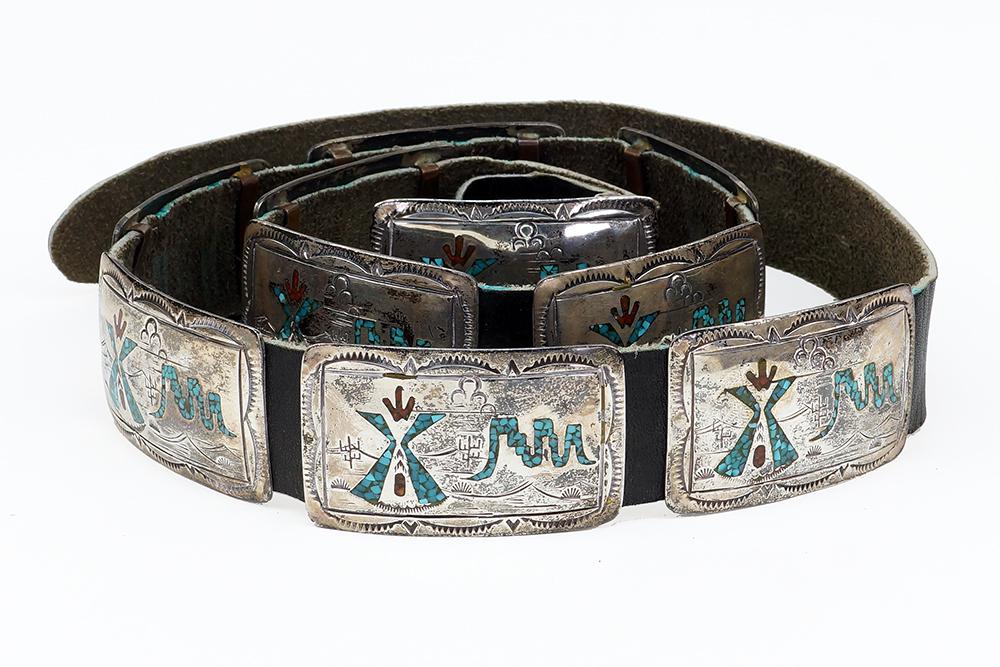 A Concha Belt.: A Concha Belt. Comprising a silver belt buckle and nine matching silver rectangular links, all decorated with compressed turquoise and coral Each link: 1.5" x 2.5"