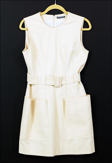 An Alexander McQueen Dress.: An Alexander McQueen Dress. Silk and cotton blend sleeveless dress with self belt and front patched pockets Size: 44