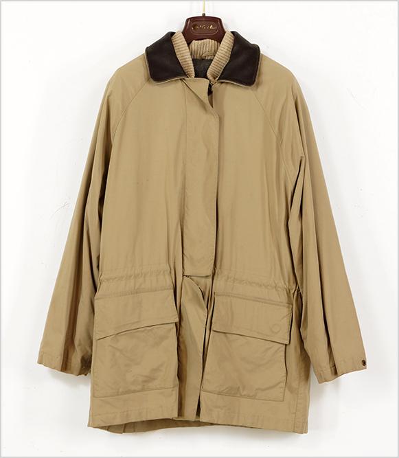 A Loro Piana Jacket.: A Loro Piana Jacket. Tan nylon jacket with a zip and concealed button closure and removable quilted vest with wool liner Size: XL