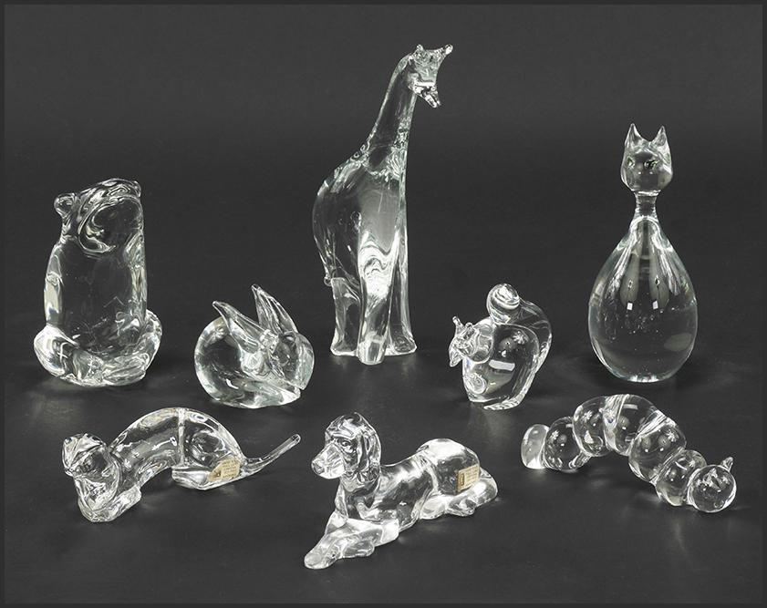 A Collection of Crystal Animal Figures.: A Collection of Crystal Animal Figures. Featuring a Konstglas Sweden frog, a Krystall Norway dog and otter figures, a Holmgard squirrel, and four unmarked figures of a cat, caterpillar, giraffe and ra