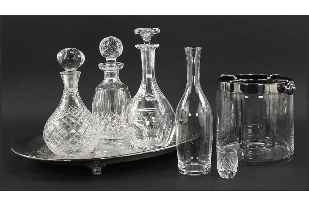A Collection of Bar Accessories.: A Collection of Bar Accessories. Comprising a Baccarat crystal decanter, a Waterford crystal decanter, a Tiffany glass bottle, a Fleuron silverplate mounted wine cooler, an unsigned crystal decanter, 