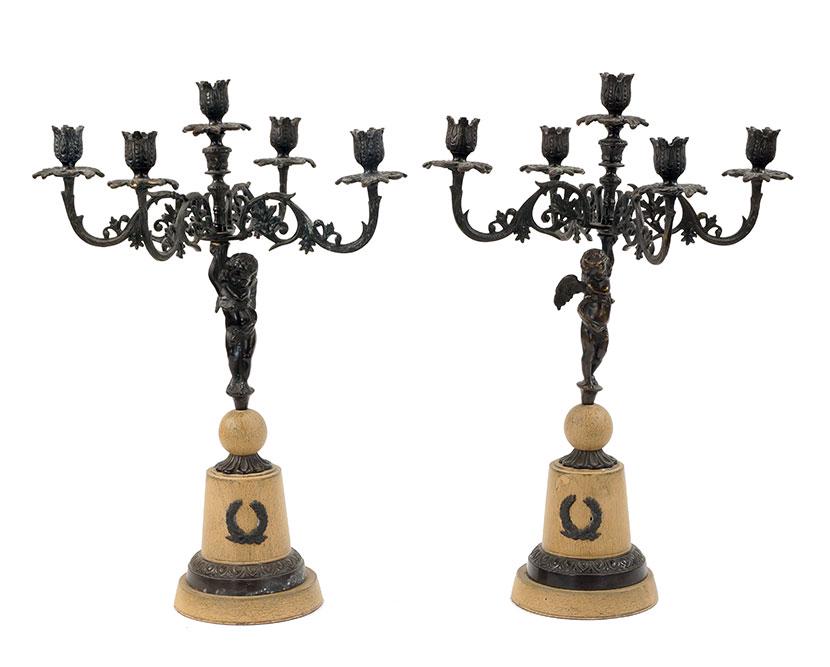 A Pair of Patinated and Painted Metal Five-Light: A Pair of Patinated and Painted Metal Five-Light Candelabra. Bearing figural stems in the form of angels Each: 21" x 16"