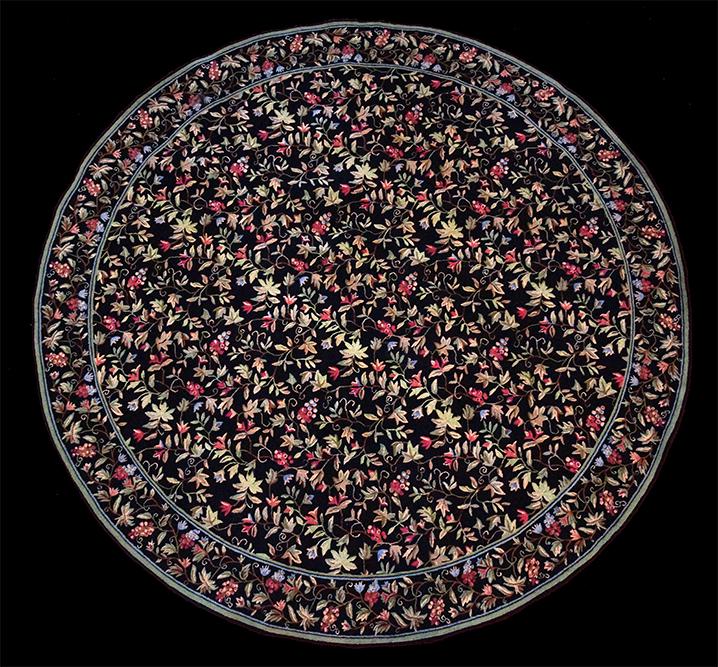 A Stark Round Floral Carpet. (1 of 1)