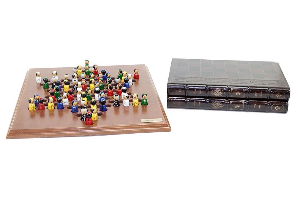 A Book Form Backgammon Game.: A Book Form Backgammon Game. Together with a Chinese Checkers game with painted wood pieces (board: 22" x 25.5") 4" x 18" x 12" when closed