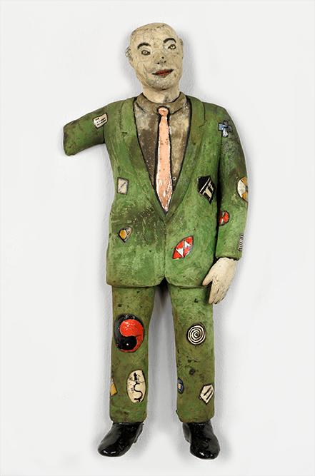 Stephen Braun (American, Contemporary) The Man in the: Stephen Braun (American, Contemporary) The Man in the Green Suit. Painted and glazed raku pottery figure of a man in a green suit with symbol decoration 20" x 9" x 3 1/2"