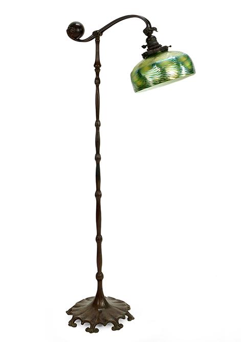 A Tiffany Studios Counter Balance Floor Lamp.: A Tiffany Studios Counter Balance Floor Lamp. Patinated bronze floor lamp is stamped "Tiffany Studios New York 619". Together with a green and metallic gold shade. The shade is unsigned and sustains e
