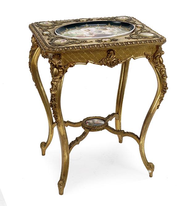 A Baroque Style Gesso and Giltwood Occasional Table: A Baroque Style Gesso and Giltwood Occasional Table with Porcelain Charger. Featuring an oval center tray (15" x 11") with four corner porcelain medallions (3" x 2" each) and side medallions (2" x 1.5