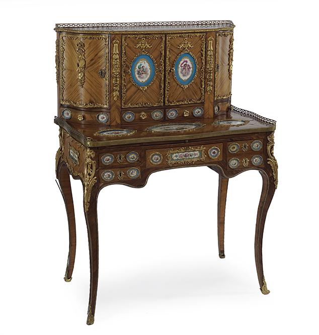 A Louis XV Style Ormolu and Porcelain Mounted Kingwood: A Louis XV Style Ormolu and Porcelain Mounted Kingwood Bonheur de Jour. The upper section opens to reveal four drawers with round floral medallions in each drawer 2" x 1.75". The doors each have cheru