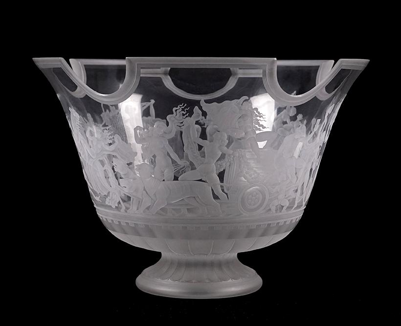 An Orrefors Bacchus Bowl.: An Orrefors Bacchus Bowl. Engraved glass bowl depicting male and female figures with animals and scenes of harvest. Underside is signed "Orrefors Cite 332 - 0111 E.G. R.P." 8.25" x 12"