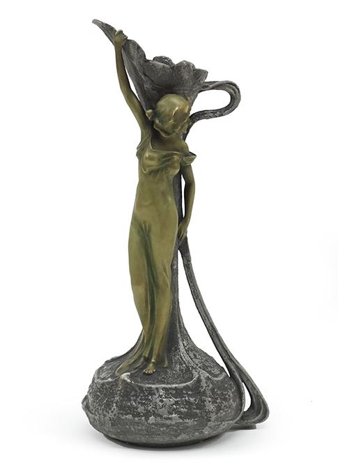 An Austrian Ernst Wahliss Vase.: An Austrian Ernst Wahliss Vase. Glazed porcelain vase with a figural support alongside. Underside bears partial Wahliss mark and is numbered 4760 10.75" x 5"