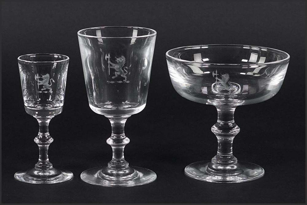 A Steuben Glass Partial Stemware Service.: A Steuben Glass Partial Stemware Service. Pattern 7725 with engraved lion crest. Service comprises 21 wine goblets, twelve champagne / sherbet goblets and eight cordials. With four Steuben for Marshal