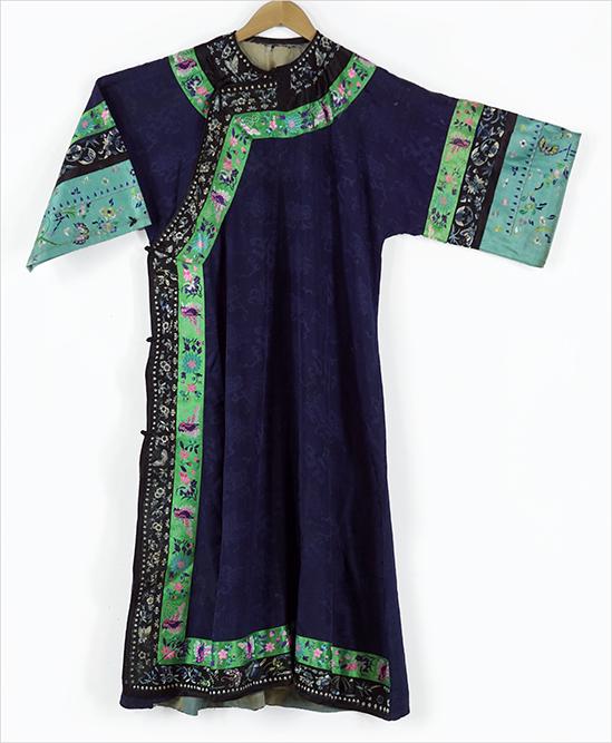 A Chinese Embroidered Robe.: A Chinese Embroidered Robe. With a design of flowers, butterflies, and symbols throughout. Measuring a height of 47", armpit to armpit: 23", and tip of sleeve to tip of sleeve: 46 1/2"