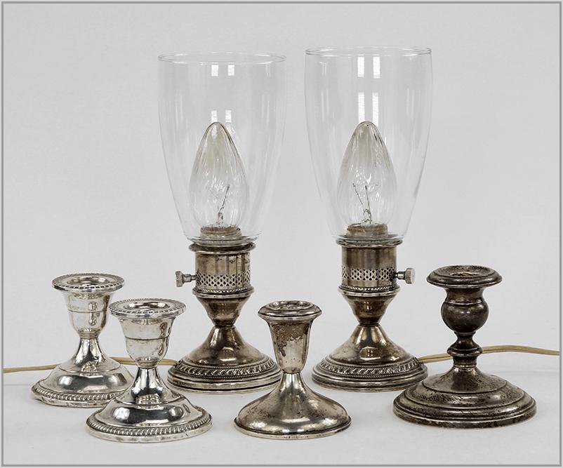 A Pair of Weighted Sterling Silver Hurricane Lamps. (1 of 1)