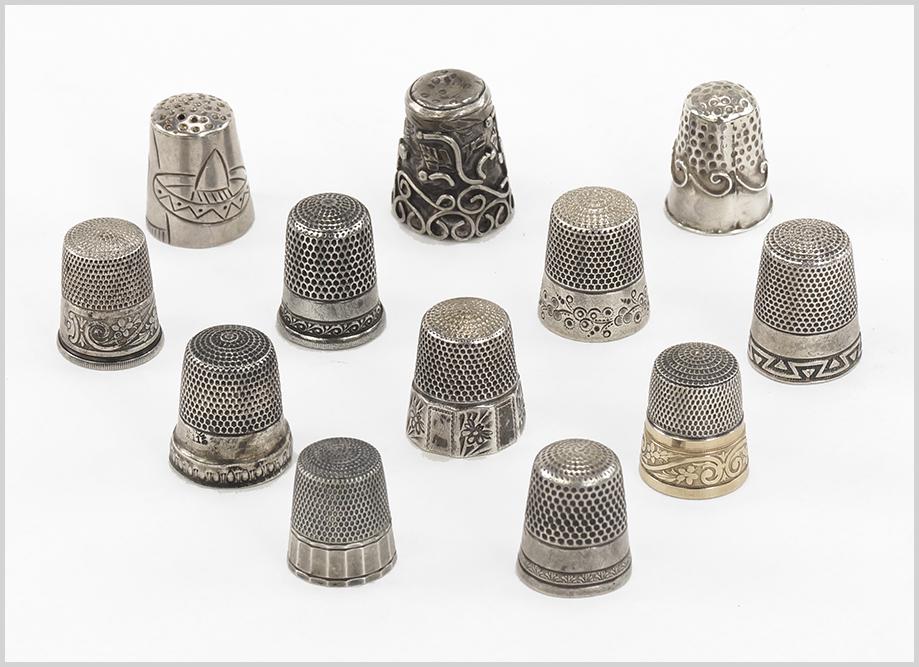 A Collection of Twelve Sterling Silver Thimbles. (1 of 1)