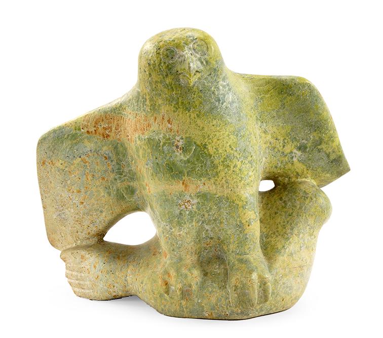 An Inuit Carved Serpentine Owl.: An Inuit Carved Serpentine Owl. Depicted perching atop a walrus. Unsigned 18 1/2" x 21" x 12"