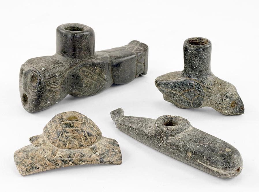 Four Inuit Carved Stone Pipes.: Four Inuit Carved Stone Pipes. Pipes have been carved into a whale, a turtle, a bird and a human figure (length: 5 1/2")