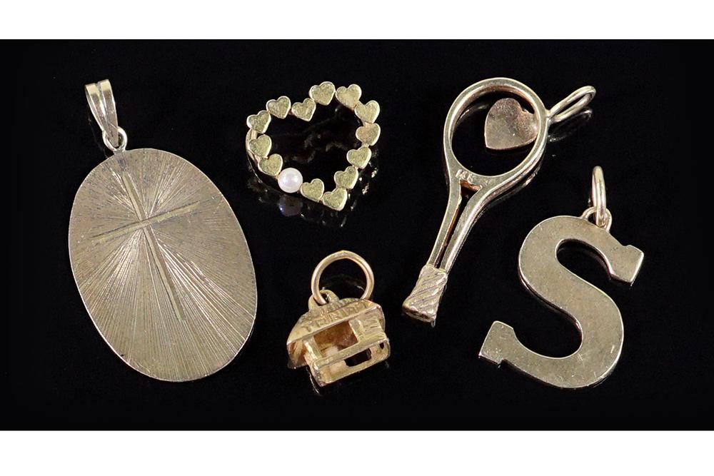 A Collection of 14 Karat Yellow Gold Pendants / Charms.: A Collection of 14 Karat Yellow Gold Pendants / Charms. Comprising a tennis racket, a letter S, n oval pendant engraved with an S, a Tahitian hut and a heart form slide pendant mounted with one cultur