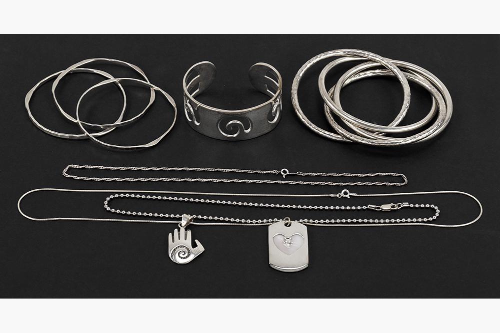 A Sterling Silver Bracelet Suite.: A Sterling Silver Bracelet Suite. Comprising four interlocking hand hammered silver bracelets. Together with three sterling silver bangle bracelets, an openwork sterling silver cuff bracelet, two ster