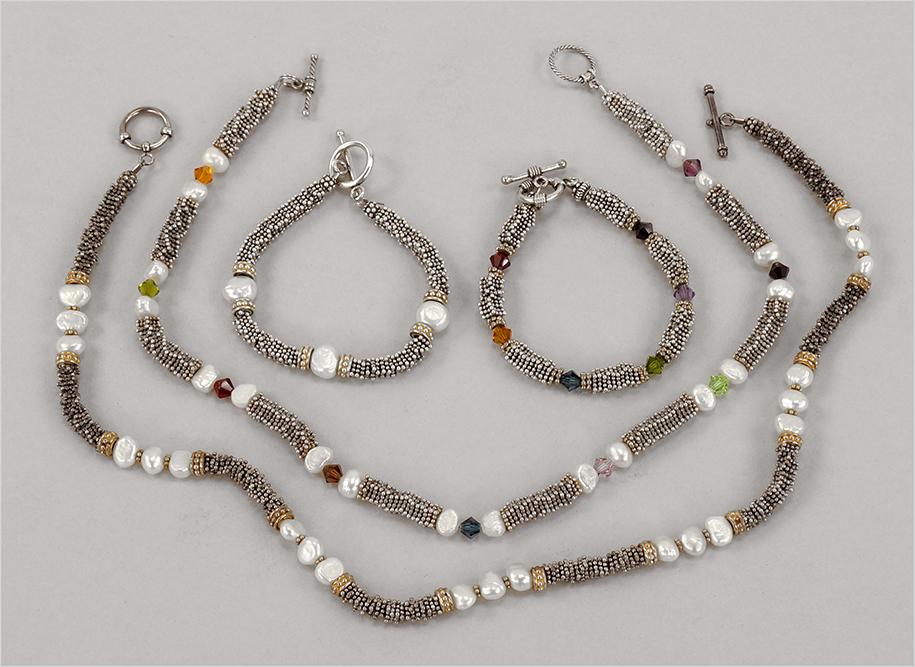 A Collection of Semi-Precious Stone Jewelry.: A Collection of Semi-Precious Stone Jewelry. Comprising two freshwater pearl and bead necklaces, with two coordinating bracelets