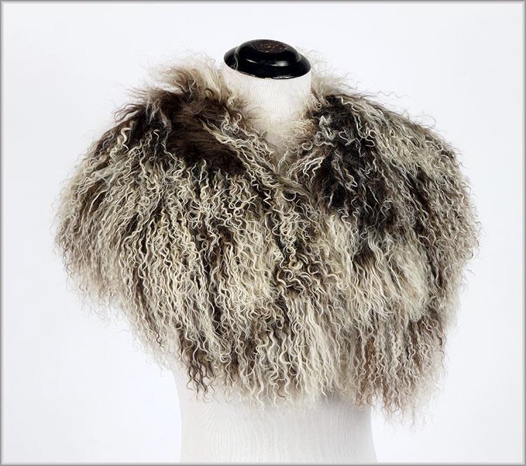 A Mongoliam Lamb Fur Collar.: A Mongoliam Lamb Fur Collar. Brown and white collar with elasticized cinch closure