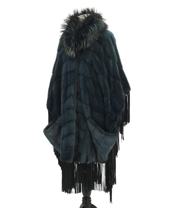 A Helen Yarmak Blue Mink Poncho.: A Helen Yarmak Blue Mink Poncho. Horizontal blue dyed mink cape with blue leather sleeve fringe and a dyed blue fox collar