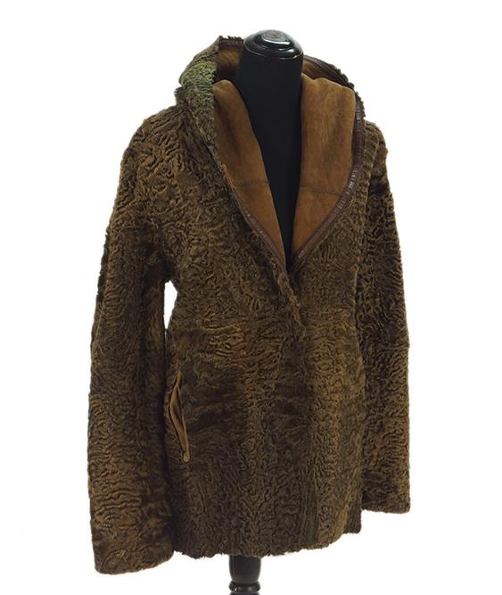 A Giuliana Teso Reversible Jacket.: A Giuliana Teso Reversible Jacket. Brown suede and leather jacket which reverses to Persian lamb; with shawl collar and button closure Size 50