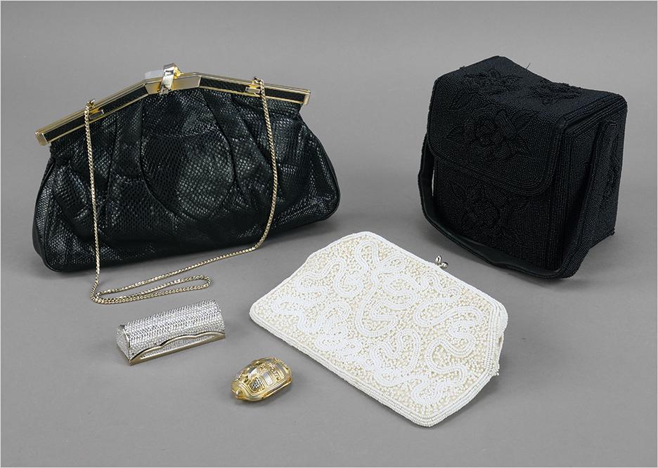 A Judith Leiber Lipstick Case.: A Judith Leiber Lipstick Case. White rhinestone and metal lipstick case with interior mirror. Together with a Judith Leiber turtle form pill box, a a Finesse LadModel black lizard skin handbag, a blac